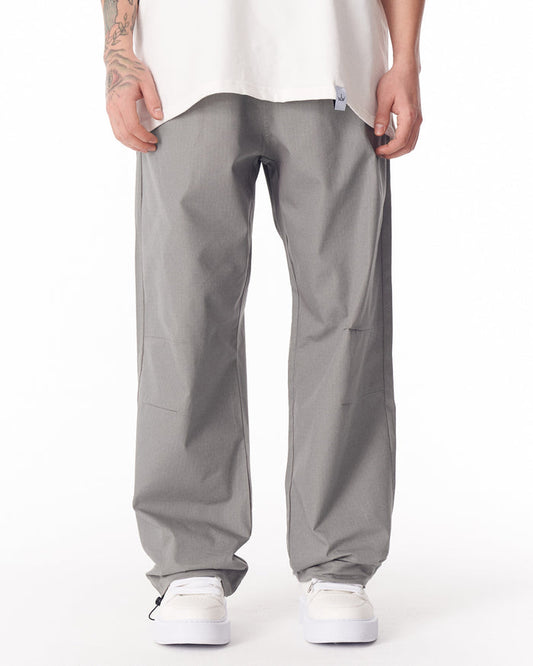 Martin Valen grey wide-leg trousers with adjustable cuff, front view focused on the crotch and low waist