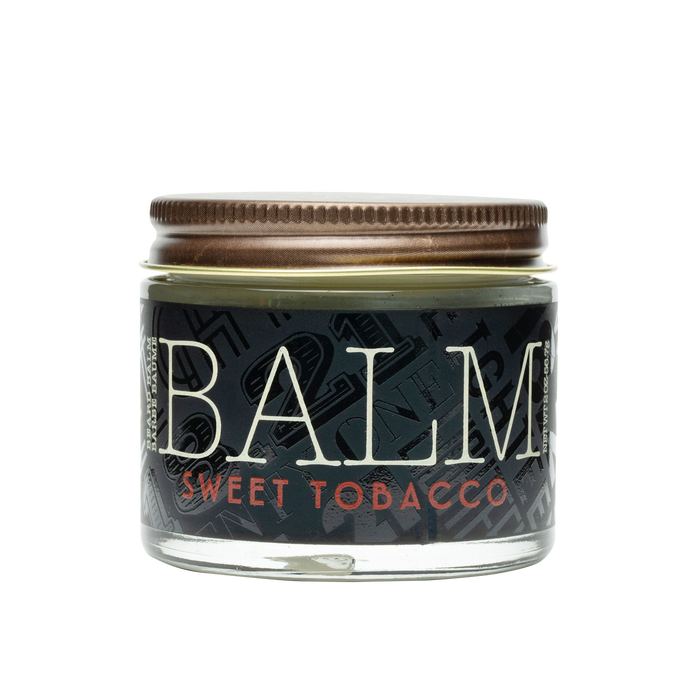 Jar of balm labeled 'Sweet Tobacco' on a white background