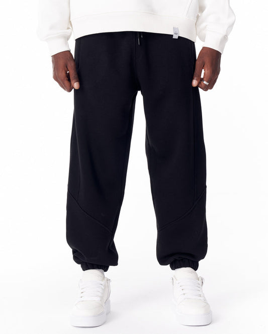 Martin Valen black corded joggers, front close-up showing drawstring waist and visible stitch detailing