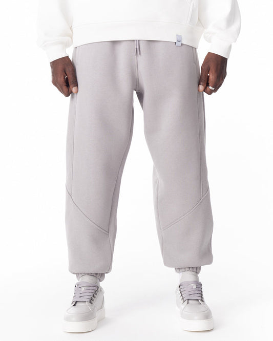 Martin Valen light gray jogger close-up at the waist, visible drawstring and decorative stitch details