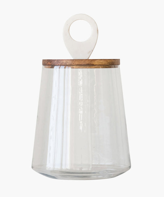 Clear glass container with a wood lid featuring a white marble circular handle on top. The design is minimalist and elegant. | SW HomeHome Co.