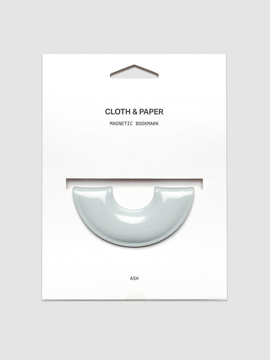 Magnetic Bookmark | Spotlight in the color Ash, a light grey, shown on a backing card