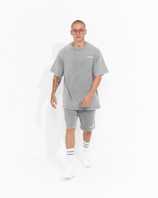 Martin Valen men's oversized grey tracksuit set with shorts, front view walking pose with small white logo on chest