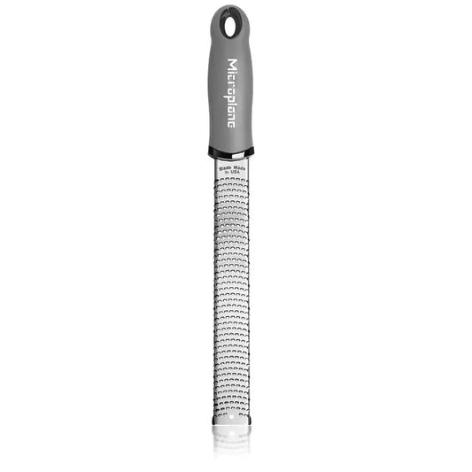 Microplane zester with gray handle on a white background
