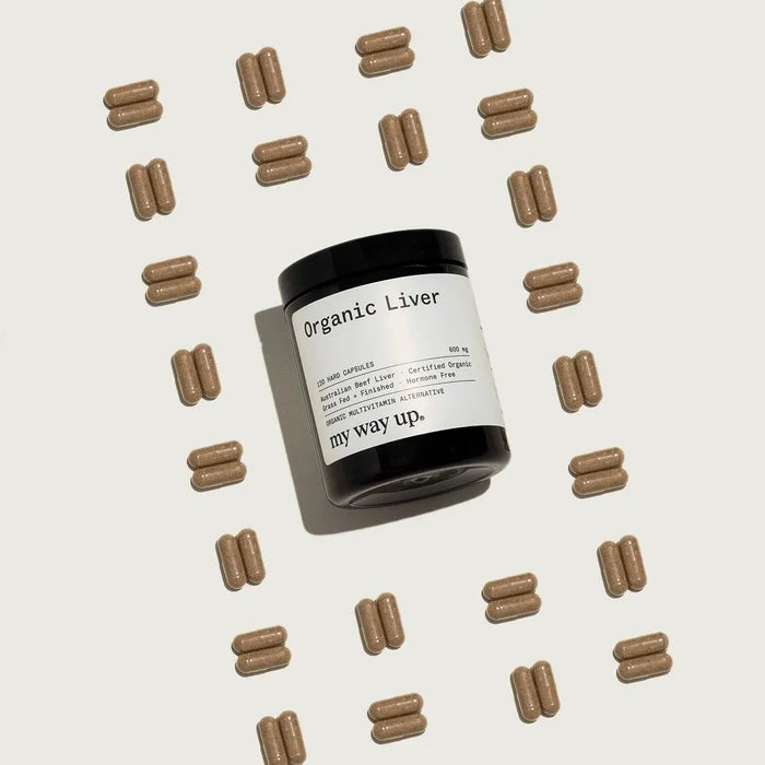 Jar of 'my way up' Organic Liver capsules surrounded by liver capsules on a beige background
