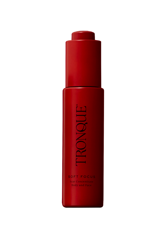 Red bottle with 'Tronque' branding on a white background